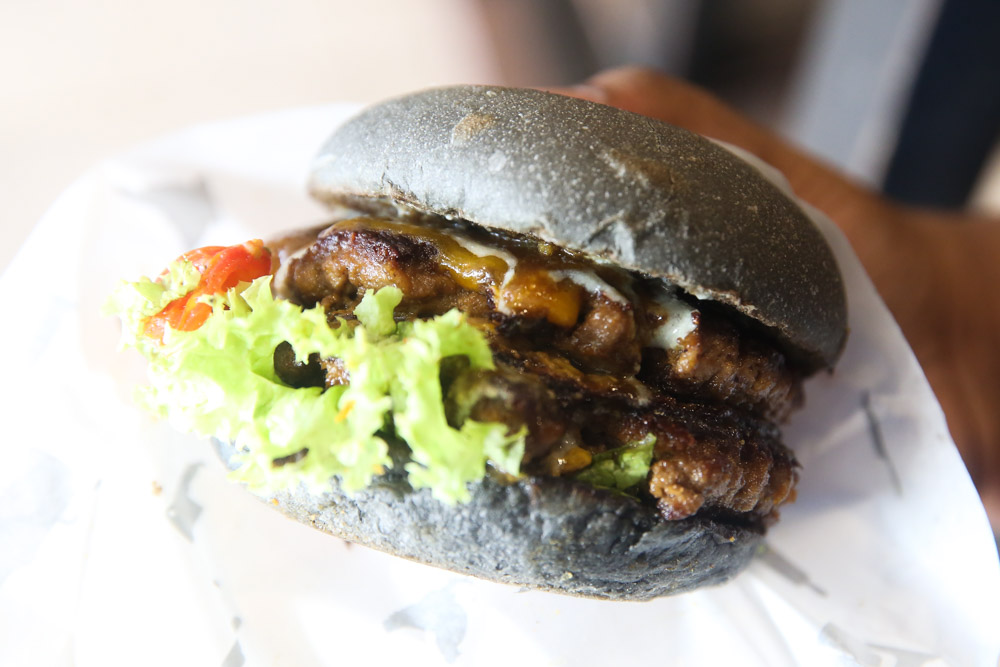 The Baby Gojira packs a delicious punch with its juicy grilled mustard and onions double beef patties stack with teriyaki wasabi sauce and blue cheese dressing.