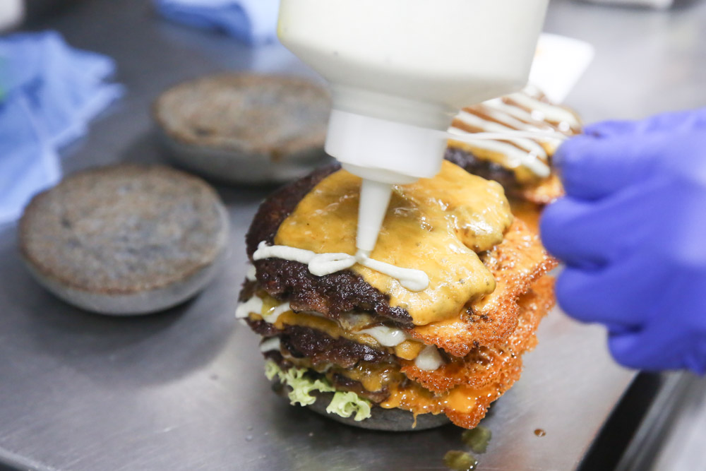 Each layer gets a drizzle of teriyaki wasabi sauce followed by the blue cheese dressing.