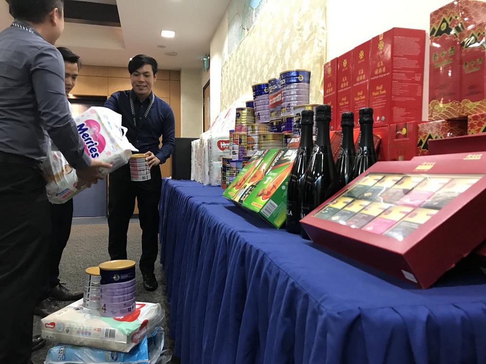 The items police seized from the suspect included more than 20 cans of milk powder, 15 pre-paid cards, and eight electronic devices. u00e2u20acu201d TODAY pic
