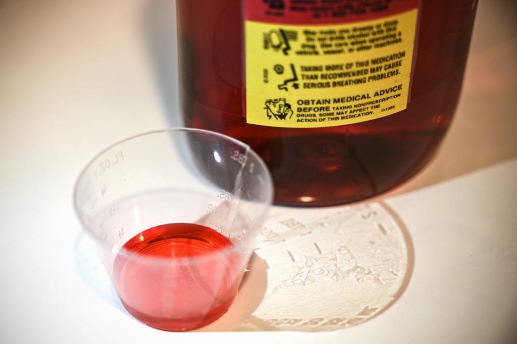 In this file photo illustration taken on March 29, 2019, a 500ml bottle of liquid oxycodone, an opioid pain relief medication, and a dose of 5ml of the solution sit on a table in Washington, DC. u00e2u20acu201d AFP pic