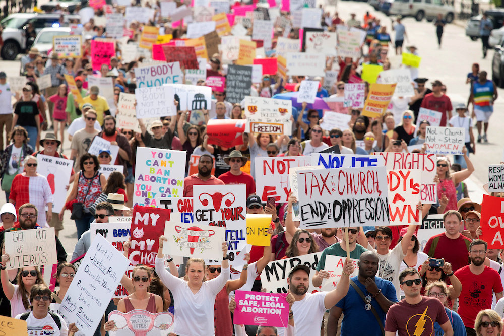 People walk to the Alabama State Capitol during the March for Reproductive Freedom against the state's new abortion law, the Alabama Human Life Protection Act, in Montgomery, May 19, 2019. u00e2u20acu201d Reuters picnn