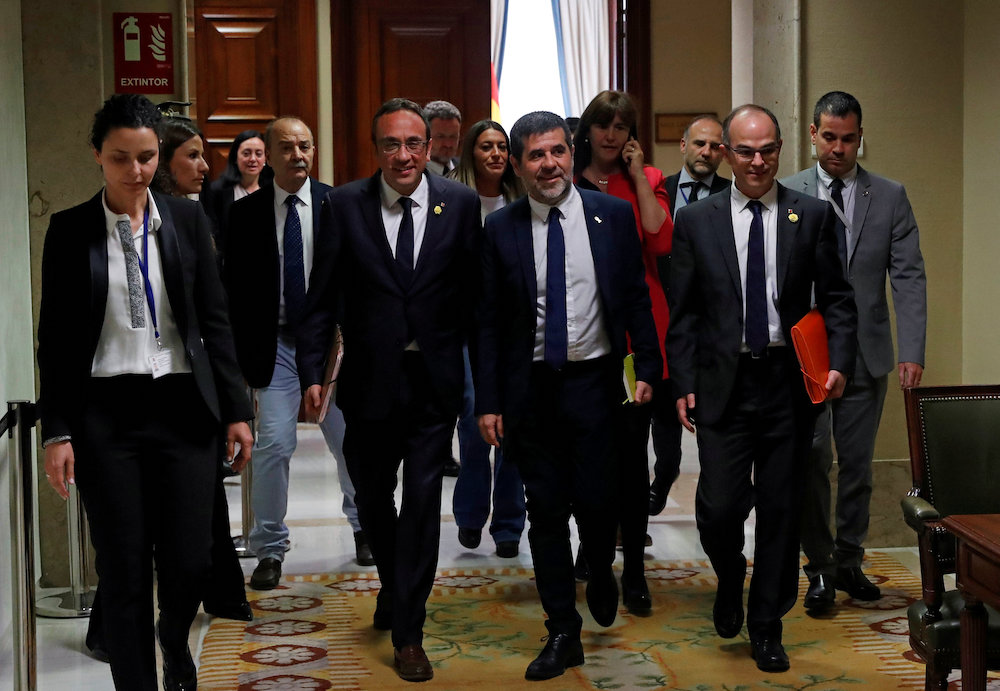 Jailed Catalan politicians Josep Rull, Jordi Sanchez and Jordi Turull leave after getting their parliamentary credentials at Spanish Parliament, in Madrid May 20, 2019. u00e2u20acu201d Reuters picnn
