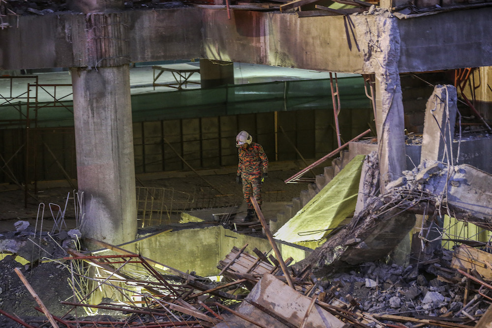 A fireman is seen at the site of the Gombak Integrated Transport Terminal car park collapse in Kuala Lumpur May 23, 2019. — Picture by Firdaus Latif