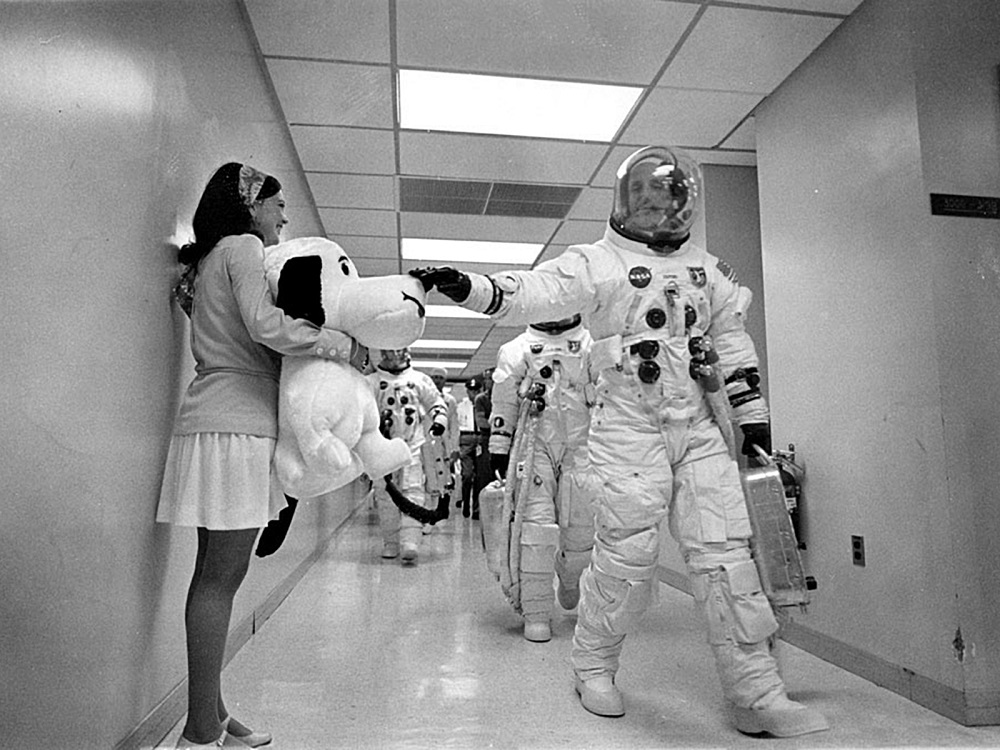 In this May 18, 1969 image, Apollo 10 Commander Tom Stafford, heading to the Kennedy Space Centre launch pad, pats the nose of a stuffed Snoopy held by Jamye Flowers (Coplin), astronaut Gordon Cooperu00e2u20acu2122s secretary. u00e2u20acu201d Handout by Nasa via AFP