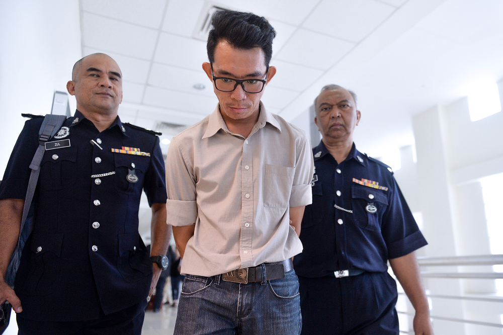 Teoh Thiam Lim was escorted by the police after he was found guilty of causing the death of marathon runner Evelyn Ang in Klang May 27, 2019. u00e2u20acu201d Picture by Mukhriz Hazim 