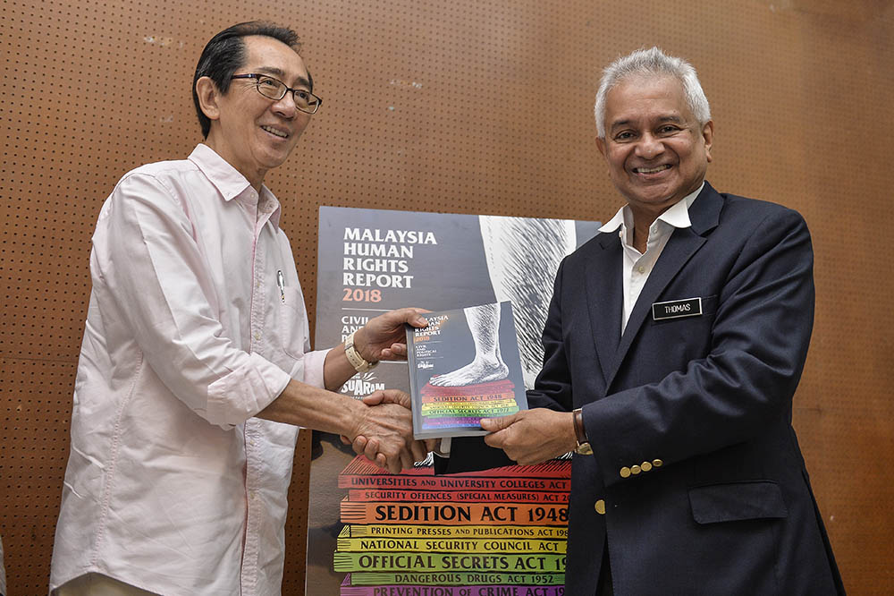 Suaram director Kua Kia Soong and Attorney General Tommy Thomas pose for pictures during the launch of the Suaram Human Rights Report 2018 in Kuala Lumpur May 28, 2019. u00e2u20acu201d Picture by Miera Zulyana