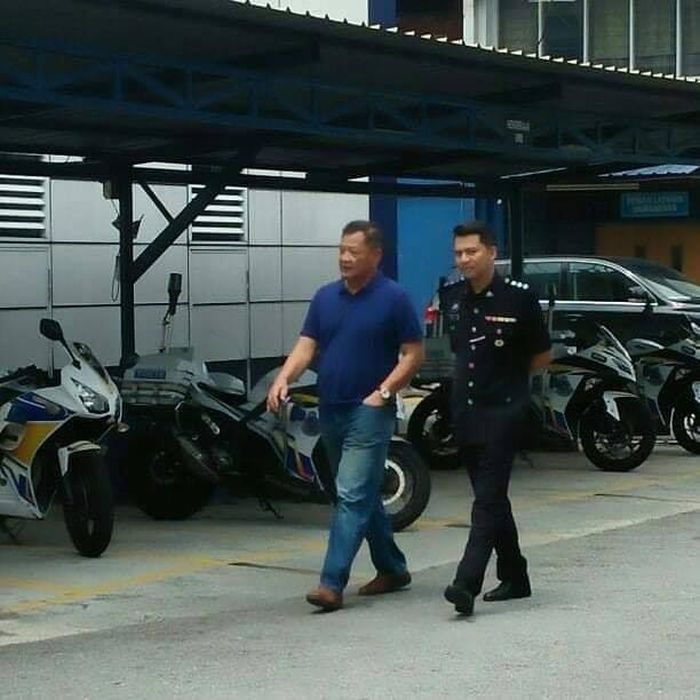 Datuk Seri Abdul Hamid Bador (left) is pictured during an impromptu visit to the Damansara Utama police station in Petaling Jaya. — Picture via Facebook