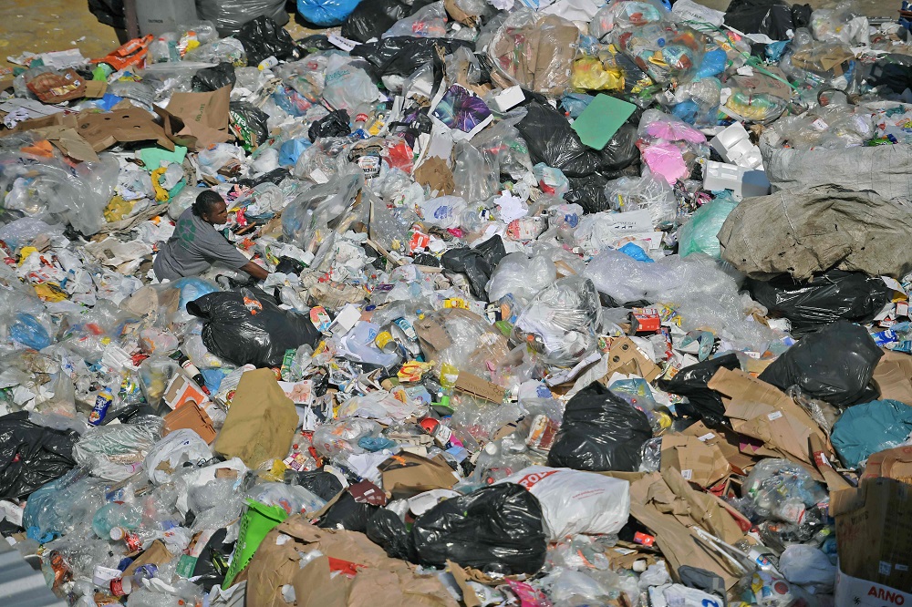 A worker sorts through rubbish at CoopFuturo, a sorting collective which receives rubbish from the local government collection service and then sells the material to specialised recycling companies, in Rio de Janeiro, Brazil May 21, 2019. u00e2u20acu201d AFP pic 