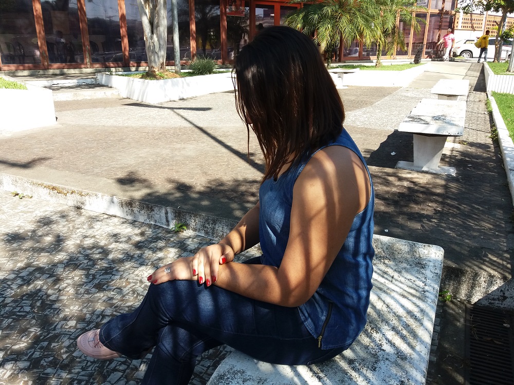 Julia, a trans woman victim of sex trafficking, sits outside a government building in the greater Sao Paulo area, in Brazil, April 30, 2019. u00e2u20acu201d Thomson Reuters Foundation pic