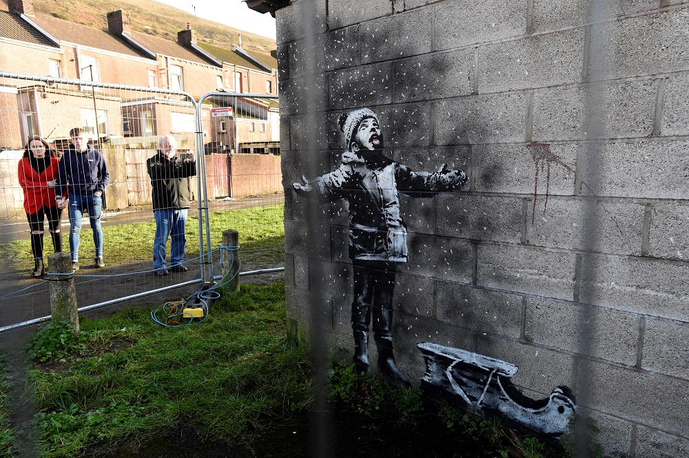 People view new work by the artist Banksy that appeared during the week on the walls of a garage in Port Talbot, Britain December 22, 2018. u00e2u20acu201d Reuters pic  