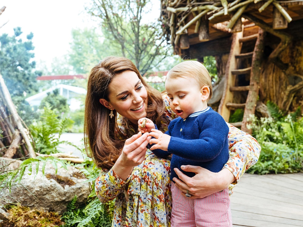 Britainu00e2u20acu2122s Catherine, Duchess of Cambridge plays with Prince Louis at the Adam White and Andree Davies co-designed garden ahead of the RHS Chelsea Flower Show in London May 19, 2019. u00e2u20acu201d Matt Porteous/PA Wire/Handout via Reuters