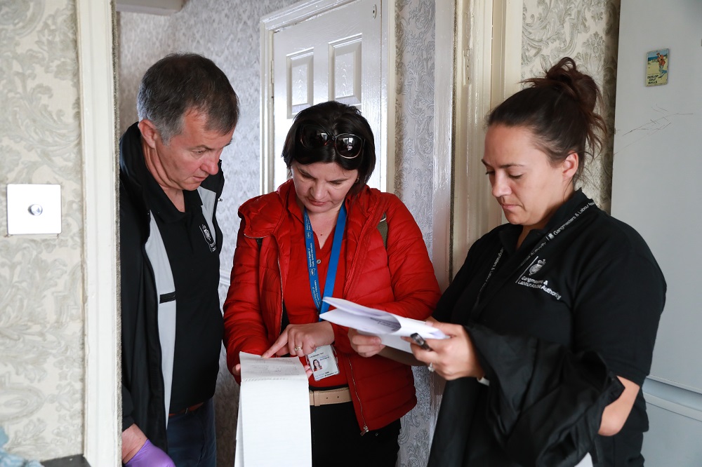 Officers from Britainu00e2u20acu2122s anti-slavery agency sift through evidence during an anti-slavery raid on a property in Birmingham May 23, 2019. u00e2u20acu201d Thomson Reuters Foundation pic
