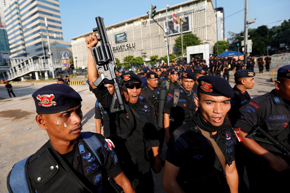 Mobile brigade (Brimob) police officers leave a protest area after last nightu00e2u20acu2122s riot following the announcement of presidential election results outside the Election Supervisory Agency (Bawaslu) headquarters in Jakarta, May 23, 2019. u00e2u20acu201d Reuters pic
