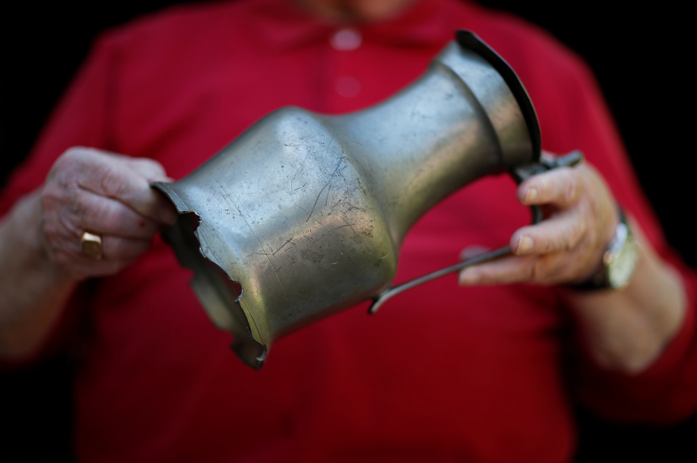Yves Faucon, 86, from Tilly-sur-Seulle in the Normandie region poses holding a cider pot with marks from the war during an interview with Reuters in Tilly-sur-Seulle, France May 14, 2019. u00e2u20acu201d Reuters pic     