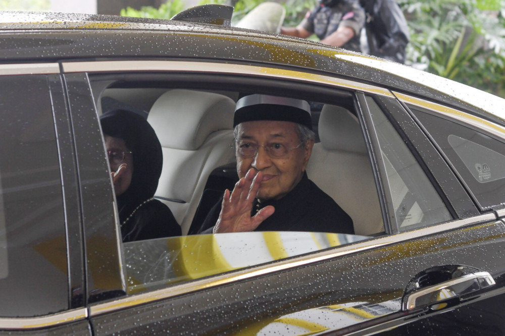 Prime Minister Tun Dr Mahathir Mohamad waves to photographers after paying his last respects to Paduka Ayahanda Sultan Ahmad Shah Al-Mustau00e2u20acu2122in Billah Almarhum Sultan Abu Bakar at Istana Negara May 22, 2019. u00e2u20acu201d Bernama pic