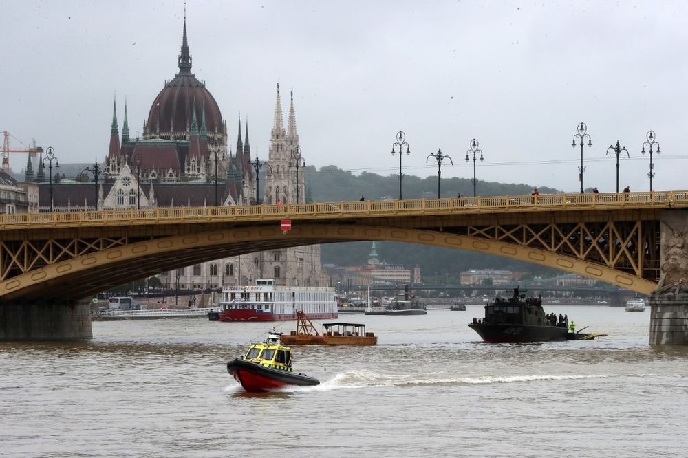Police and rescue boats are seen on the Danube river near the zone where the u00e2u20acu02dcMermaidu00e2u20acu2122 sightseeing boat sank overnight after colliding with a larger vessel in pouring rain on May 30, 2019 in Budapest. u00e2u20acu201d AFP pic