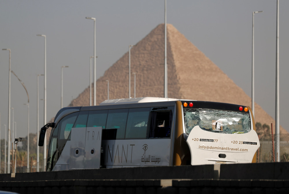 A damaged bus is seen at the site of a blast near a new museum being built close to the Giza pyramids in Cairo, Egypt May 19, 2019. u00e2u20acu201d Reuters pic  