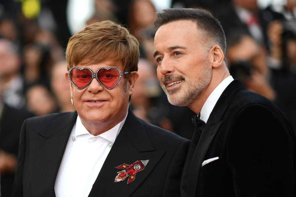 British singer-songwriter Elton John and his husband Canadian producer David Furnish arrive for the screening of the film u00e2u20acu02dcRocketmanu00e2u20acu2122 at the 72nd edition of the Cannes Film Festival in Cannes, May 16, 2019. u00e2u20acu201d AFP pic