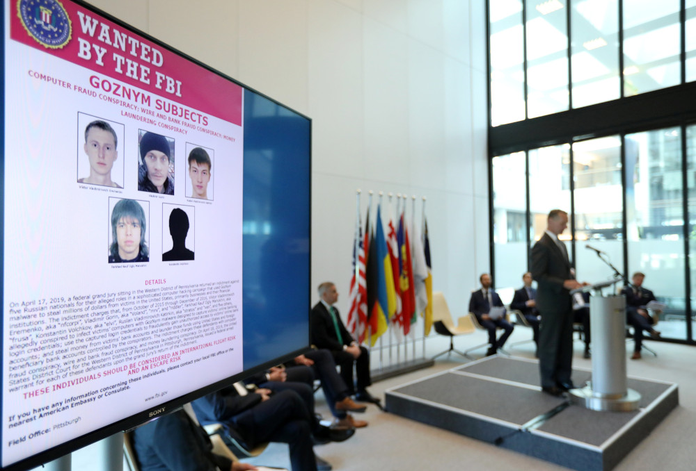 Suspects of cybercrime are seen on the screen at the news conference to announce a major law enforcement action against a transnational organised cybercrime at the Europolu00e2u20acu2122s headquarters in The Hague, Netherlands, May 16, 2019. u00e2u20acu201d Reuters pic 