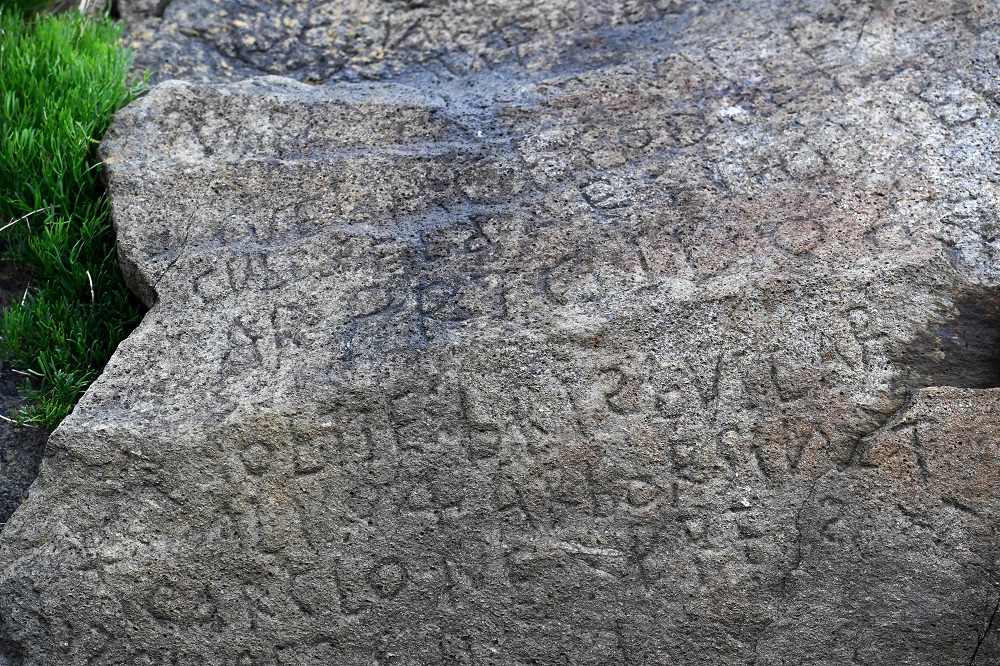 This picture taken on May 7, 2019 shows inscriptions composing indecipherable words on a rock in the Brittany village of Plougastel-Daoulas. u00e2u20acu201d AFP pic      