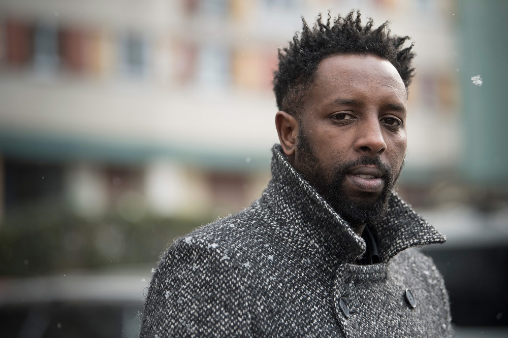 In this file photo taken on February 27, 2018, French director Ladj Ly poses under the snow during a portrait session in the Chene Pointu council estate in Clichy-sous-Bois, where some scenes of his short film u00e2u20acu02dcLes Miserablesu00e2u20acu2122 were filmed. u00e2u20acu201d AFP pic