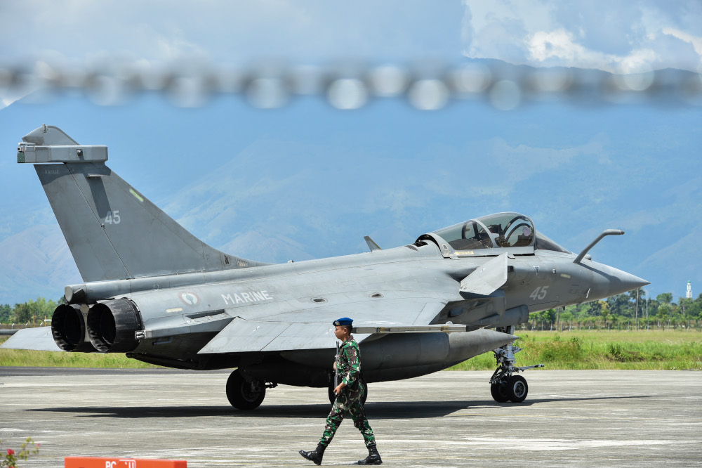 An Indonesian soldier stands guard near a French Rafale fighter jet at an air force base in Blang Bintang, Aceh province May 19, 2019. u00e2u20acu201d AFP pic 