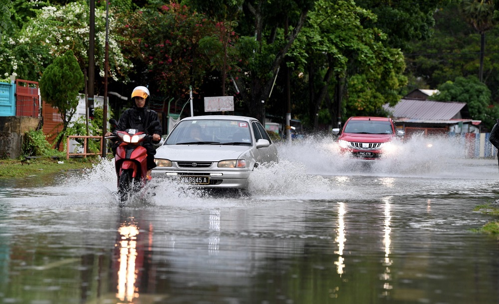 Vehicles drive in the flood at Jalan P. Ramlee in George Town May 6, 2019. u00e2u20acu2022 Bernama pic