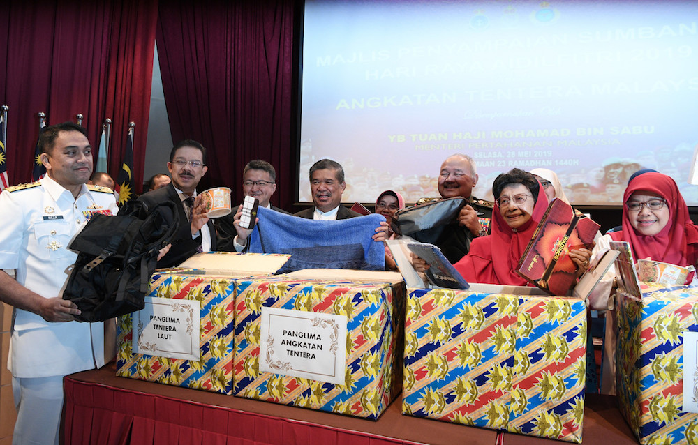 Tun Dr Siti Hasmah Mohd Ali holds some of the Hari Raya goodies that will be distributed to Malaysian Armed Forces personnel on duty during the festive season in Kuala Lumpur May 28, 2019. u00e2u20acu201d Bernama pic