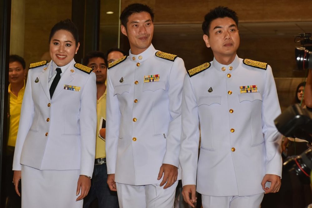 Future Forward Party leader Thanathorn Juangroongruangkit, secretary-general Piyabutr Saengkanokkul (right) and spokesperson Pannika Wanich (left) gather to attend a ceremony for the commencement of parliament in Bangkok on May 24, 2019. u00e2u20acu201d AFP pic
