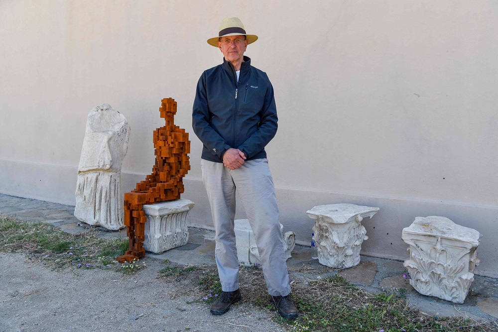 Renowned British artist Antony Gormley poses next to his sculpture called ‘Rule’ during his exhibition ‘Sight’ at the archaeological site of the island of Delos, a Unesco World Heritage Site May 3, 2019. — AFP pic     