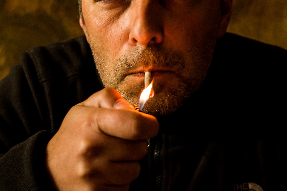A man smokes in the Booze Cooperativa bar in Athens on May 07, 2019. u00e2u20acu201d AFP pic     