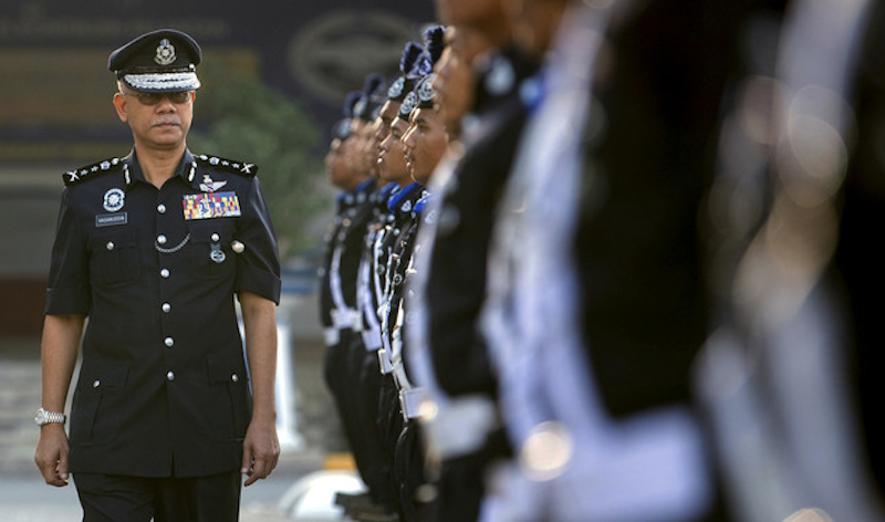 Kelantan police chief Datuk Hasanuddin Hassan inspects an honour guard in Kota Baru April 9, 2019. u00e2u20acu201d Bernama pic
