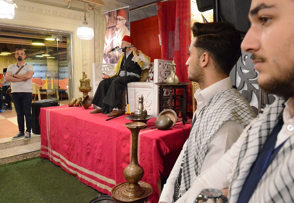 Traditional storyteller Abdel Wahed Ismail (second from left), entertains an audience in the northern Iraqi city of Mosul, during the holy Muslim month of Ramadan May 17, 2019. u00e2u20acu201d AFP pic  