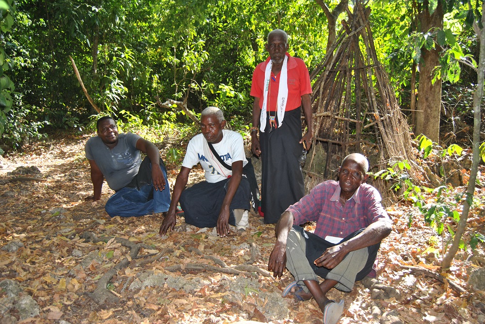 Abdala Ali Munyenze (standing) poses with members of the Digo community elders committee inside the Kinondo Kaya forest in Kwale County, Kenya February 11, 2019. u00e2u20acu201d Thomson Reuters Foundation pic