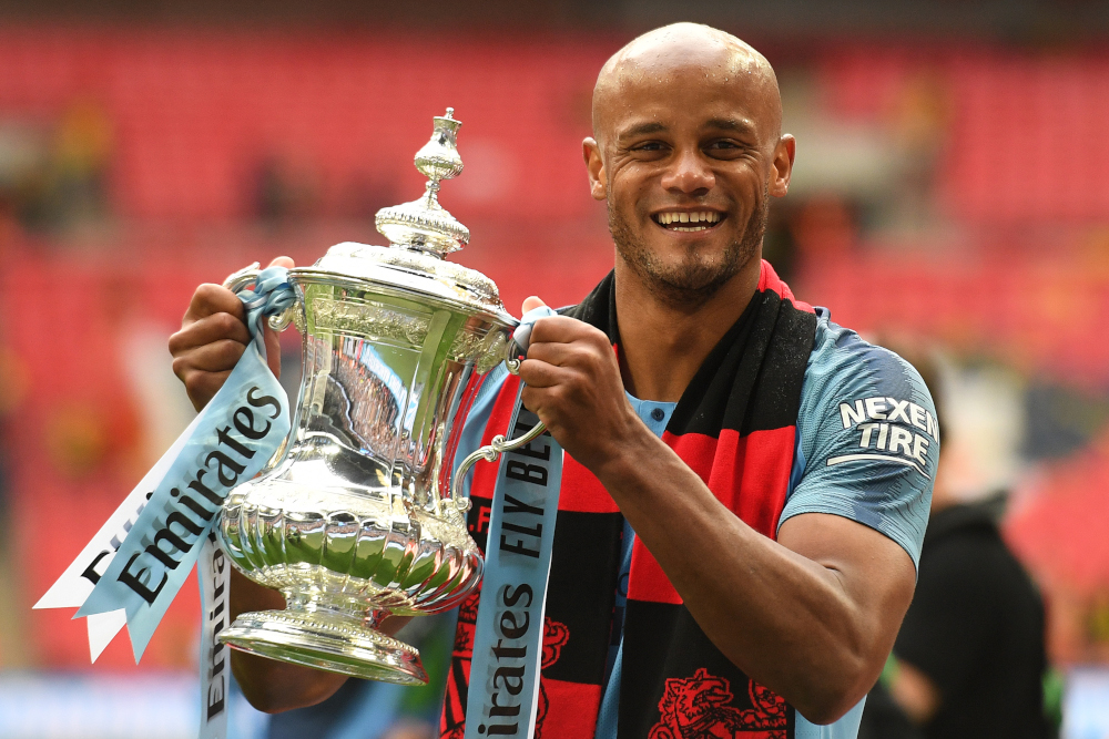 Manchester Cityu00e2u20acu2122s Belgian captain Vincent Kompany holds the winneru00e2u20acu2122s trophy after the English FA Cup final football match between Manchester City and Watford at Wembley Stadium in London, May 18, 2019. u00e2u20acu201d AFP pic 
