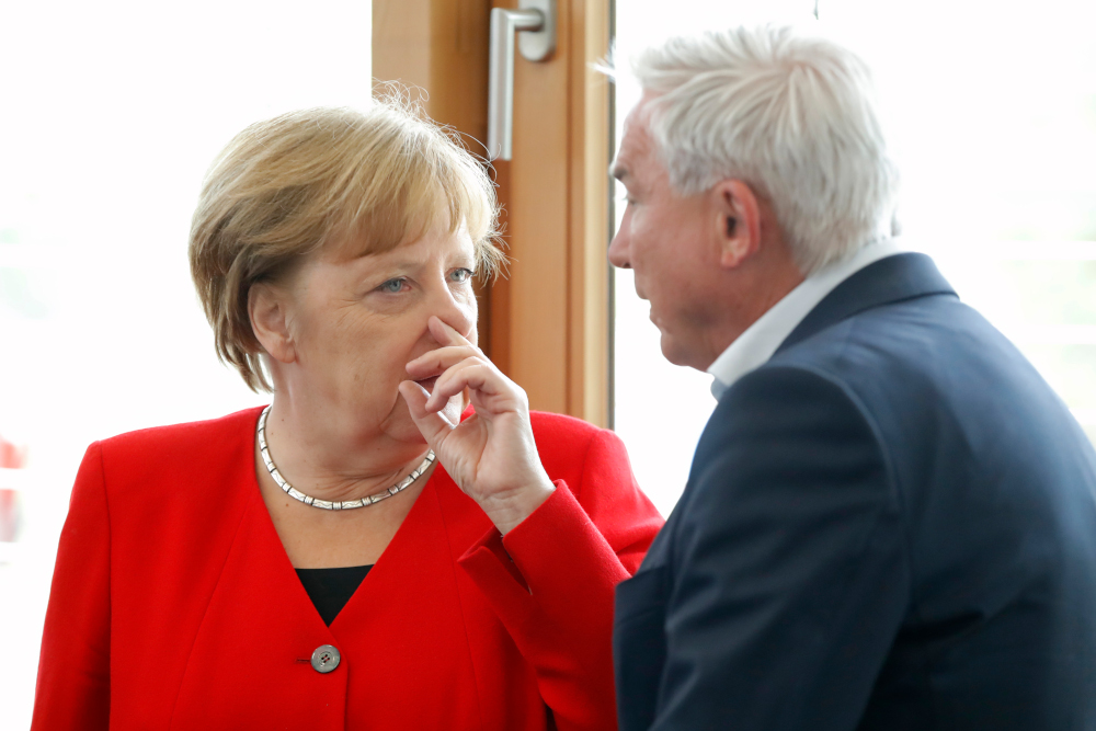German Chancellor Angela Merkel talks with a party member during a leadership meeting of the conservative Christian Democratic Union (CDU) party May 27, 2019 at the partyu00e2u20acu2122s headquarters in Berlin, a day after the European elections. u00e2u20acu201d AFP pic  
