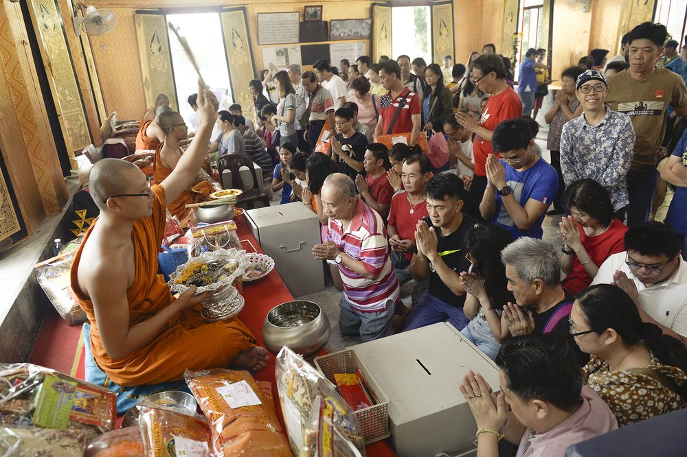 Buddha devotees pray at the Thai Buddhist Chetawan Temple on Wesak Day marking the birth of Gautama Buddha, his attaining enlightenment, and his passing away, in Petaling Jaya, May 19, 2019. u00e2u20acu201d Picture by Mukhriz Hazim
