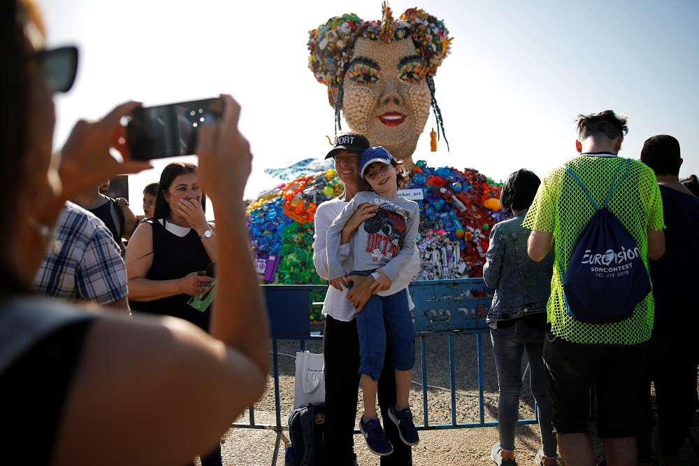 People pose near an artwork titled u00e2u20acu02dcToyu00e2u20acu2122, the name of the winning song for 2018u00e2u20acu2122s Eurovision Song Contest as they visit the Eurovision Village, an area dedicated to fans of the Eurovision Song Contest, in Tel Aviv May 14, 2019. u00e2u20acu201d Reuters pic      