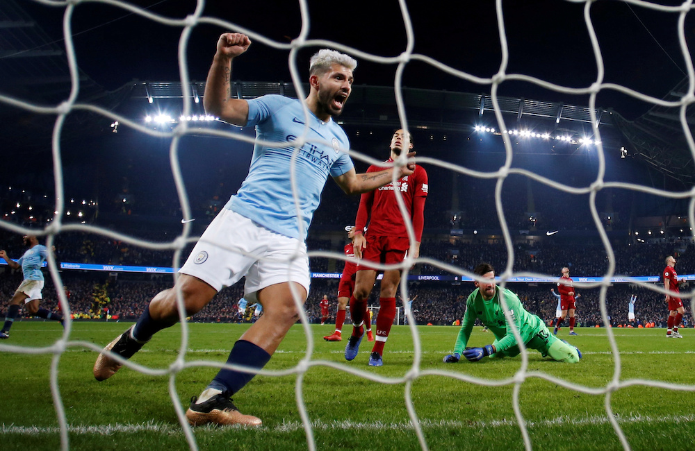ManchesterCityu00e2u20acu2122s Sergio Aguero celebrates their second goal scored by Leroy Sane (not pictured) as Liverpoolu00e2u20acu2122s Alisson and Virgil van Dijk look dejected at the Etihad Stadium in Manchester, January 3, 2019. u00e2u20acu201d Reuters pic