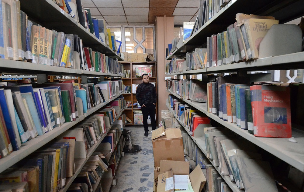 A man stands amidst dusty books in the new library of Mosul University in Iraqu00e2u20acu2122s northern city of Mosul April 17, 2019. u00e2u20acu201d AFP pic 