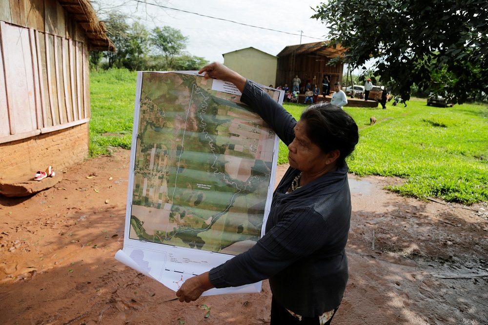 Community leader Cornelia Flores holds a map showing the community's territory which is being monitored with a smartphone app and GPS to protect lands and preserve forests, in Isla Jovai Teju, Paraguay May 9, 2019. u00e2u20acu201d Reuters pic