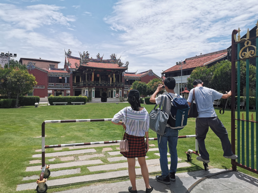Tourists taking photos of a heritage clan house in George Town, a Unesco world heritage site in the Penang, April 28, 2019. u00e2u20acu201d Picture from Thomson Reuters Foundation/Beh Lih Yi