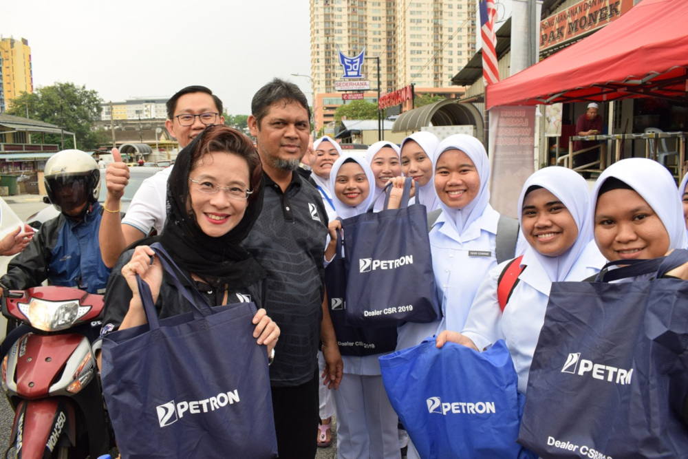 As part of Petronu00e2u20acu2122s yearly initiative, 30 pots of the traditional porridge were cooked to be distributed to the public. u00e2u20acu201d Picture courtesy of Petron
