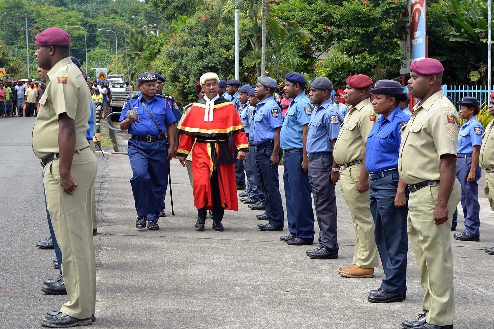 This picture taken on March 4, 2019 shows parade commander Julie Palakai (centre left) escorting new residential Judge Justice Stephen Kassman during a guard of honour parade outside Kokopo Police station in Kokopo, Papua New Guinea. u00e2u20acu201d AFP pic       