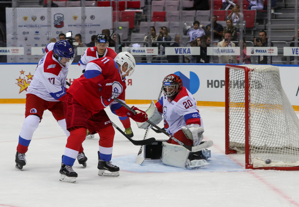 Russian President Vladimir Putin scores a goal during the Night Hockey League match at the Bolshoy Ice Dome, in Sochi May 10, 2019. u00e2u20acu201d Sputnik handout pic via AFP 