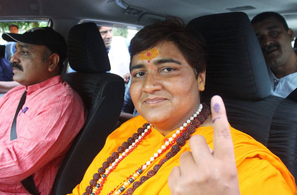 Pragya Singh Thakur, leader of ruling Bharatiya Janata Party (BJP), shows her ink-marked finger after casting her vote, outside a polling station in Bhopal, India, May 12, 2019. u00e2u20acu201d Reuters pic
