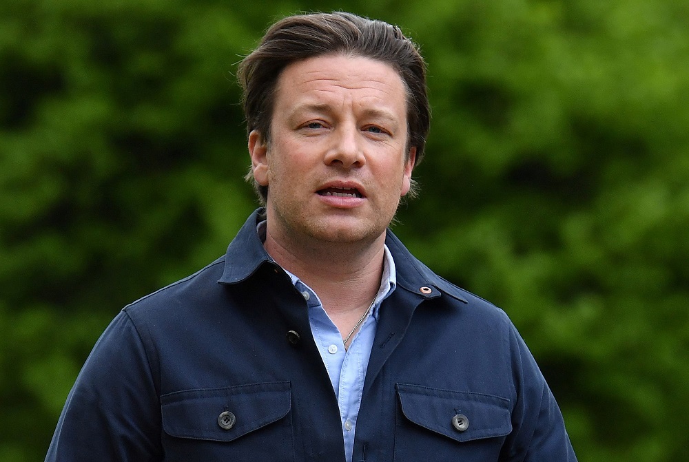 In this file photo taken on May 1, 2018, British chef and activist Jamie Oliver arrives to speak to members of the media after speaking on the subject of childhood obesity at Parliamentu00e2u20acu2122s Health and Social Care Committee in London. u00e2u20acu201d AFP pic          