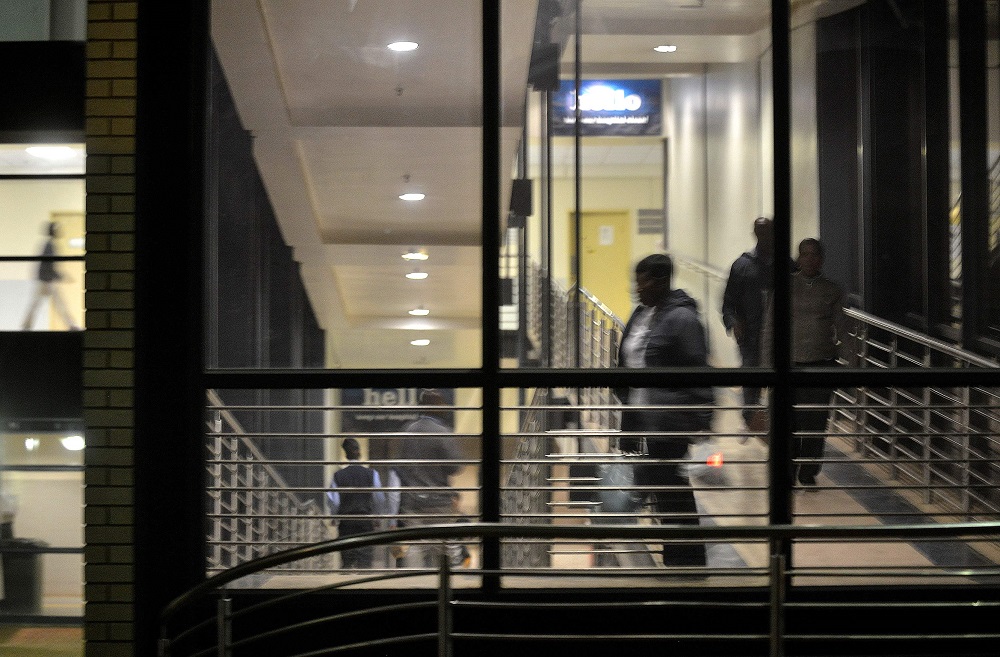 In this file photograph taken on April 24, 2014, people walk on a public passage at the Chris Hani Baragwanath Hospital in the South African landmark township of Soweto. u00e2u20acu201d AFP pic       