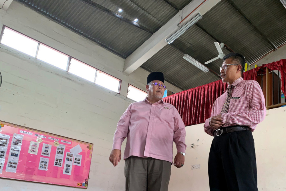 State Education, Human Resource, Science and Technology Committee chairman Aminolhuda Hassan with school headmaster Mohd Dini Karim at the rotting hall of Sekolah Kebangsaan Pendidikan Khas (SKPK) Princess Elizabeth hall May 20, 2019. u00e2u20acu201d Bernama pic
