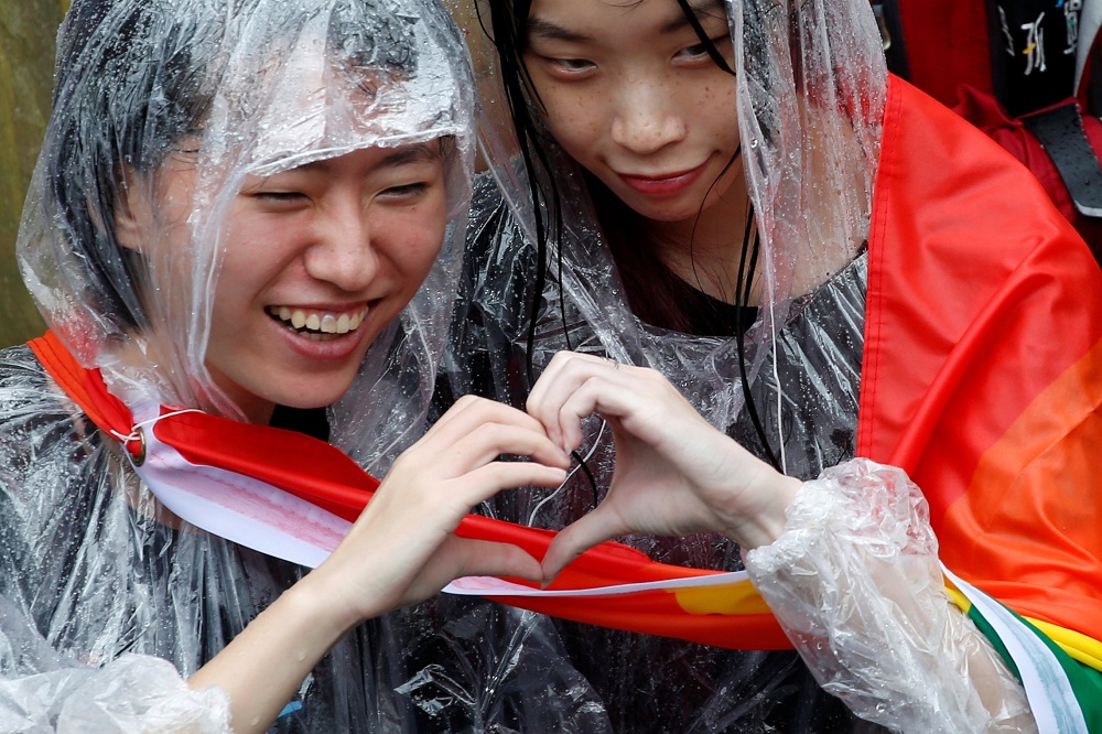 Same-sex marriage supporters pose for photo during a parliament vote on three draft bills of a same-sex marriage law, outside the Legislative Yuan in Taipei, Taiwan May 17, 2019. u00e2u20acu201d Reuters pic
